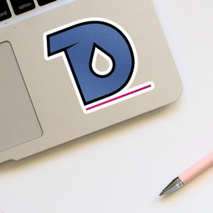 Design Ink Digital's logo as a sticker on a laptop is just one way we could create promotional products for our brand identity. How can DesignInk Digital help you get your swag on?